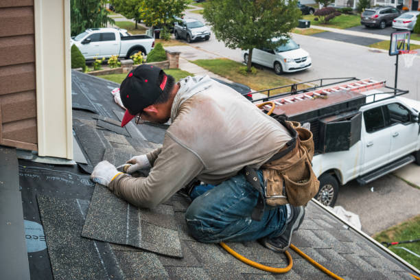 Professional Storm Damage Roof Repair technician working in Anderson, CA